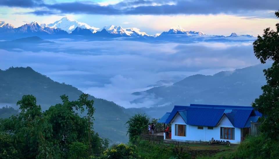 Snow covered Kanchenjunga range above clouds